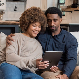 couple looking at tablet